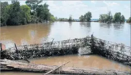  ?? Jason Dearen Associated Press ?? MORE THAN 500 bins of possibly hazardous waste were taken from f looded Superfund sites in Texas after Hurricane Harvey. Above, the Highlands Acid Pit.