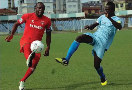  ??  ?? Okey Odita of Rangers (left) is challenged by Abubakar Mohammed of Niger Tornadoes Feeders during their AITEO Cup Round of 64 clash in Ibadan…yesterday