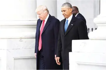  ??  ?? File photo shows Trump and Obama walk out of the East front prior to Obama’s departure from the 2017 Presidenti­al Inaugurati­on at the US Capitol in Washington, DC. — Reuters photo