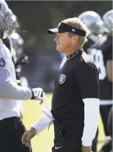  ??  ?? At training camp, Gruden is back into the old grind. He still awakens when it’s dark outside and scripts every practice himself on a computer.
