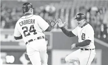  ?? LEON HALIP, GETTY IMAGES ?? Omar Vizquel, right, now the Tigers first- base coach, played 24 years in the major leagues.