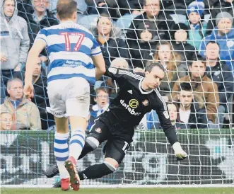  ??  ?? Lee Camp goes down to make a save against QPR at Loftus Road. Picture by Frank Reid.