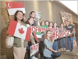  ??  ?? CHRISTIAN Vasquez, who played the role of Oscar in the film, posing with PLDT Global employees and guests.