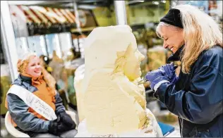  ?? COURTESY OF MIDWEST DAIRY ?? Linda Christense­n carves a likeness of Amy Kyllo, 2019’s Princess Kay of the Milky Way, at the Minnesota State Fair. Christense­n began the niche portraits in 1972.