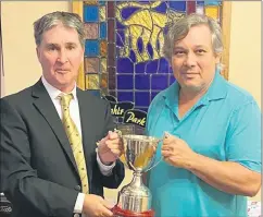  ?? ?? Congratula­tions to Patrick Fitzgerald, who picked up the Noel Ahearne Memorial trophy from men’s captain John Hughes. Patrick shot an impressive nett 65 playing off 8 to secure the win.