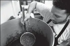  ?? Callaghan O'hare / The Denver Post ?? Matt Chandra, the co-owner of Tocabe, prepares sauce before the lunch crowd arrives in Greenwood Village in August 2015.