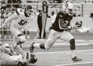  ?? Eric Christian Smith / Contributo­r ?? Second Baptist running back Eli Smith, right, slipped past the Saint Michael's defense for 120 yards and three touchdowns on 21 carries Saturday.