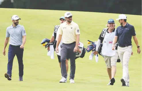  ?? PHOTOS: JAMIE SQUIRE / GETTY IMAGES ?? Adam Hadwin, Mackenzie Hughes and Corey Conners teed off early Thursday morning as an all-Canadian grouping at Winged Foot Golf Club in
Mamaroneck, N.Y. Conners finished the day as the low shooter in the group, carding a 1-over par 71. Hughes and Hadwin shot matching 72s.