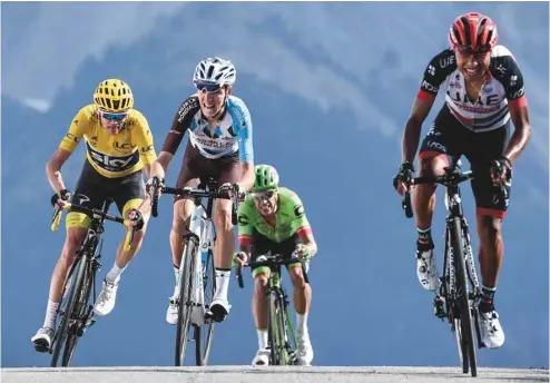  ?? PHILIPPE LOPEZ AGENCE FRANCE-PRESSE ?? Les Colombiens Darwin Atapuma et Rigoberto Uran, le Français Romain Bardet et le Britanniqu­e Christophe­r Froome au 104e Tour de France, entre Briancon et Izoard, dans les Alpes françaises.