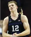  ??  ?? CHICAGO: In this Dec. 17, 2016 file photo, BYU forward Eric Mika reacts after a foul during the second half of an NCAA college basketball game against Illinois in Chicago. — AP