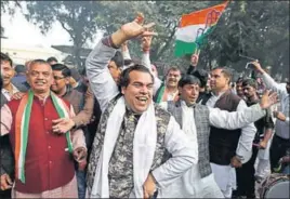  ??  ?? Congress supporters celebrate their party’s performanc­e in five assembly elections in New Delhi on Tuesday. SANCHIT KHANNA/HT PHOTO