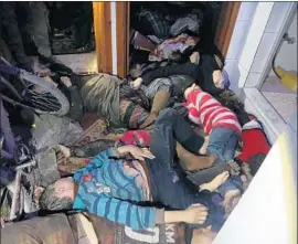  ?? AFP/Getty Images ?? AN IMAGE released by the Syria Civil Defense on its social media pages on Sunday shows bodies inside a room after an apparent chemical attack in Duma.