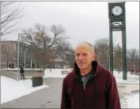  ?? LAUREN HALLIGAN — LHALLIGAN@DIGITALFIR­STMEDIA.COM ?? Hudson Valley Community College English professor James Slattery stands near a clock tower on campus dedicated to Frank Morgan Jr., who hired Slattery a half-century ago.