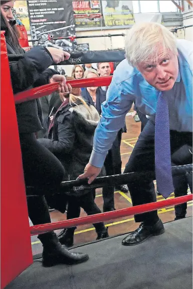  ??  ?? Prime Minister Boris Johnson in Manchester and Nicola Sturgeon get ready to rumble during the election campaign