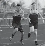  ?? Bud Sullins/Special to the Herald-Leader ?? Isaac Leachman, left, takes the baton from Dillon Ferguson last Thursday in the 4x800-meter relay during the Panther Relays.