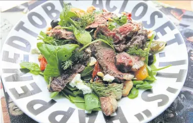  ??  ?? Charcoal-grilled iwate steak and goat cheese salad.