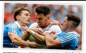 ??  ?? ROADBLOCK: Harte sees Dublin as defensive-minded too, as Mattie Donnelly discovered against Michael Fitzsimons and Philly McMahon earlier this summer