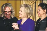  ?? Bebeto Matthews / Associated Press ?? Former U.S. Secretary of State Hillary Clinton stands between Sheila Johnson, right, founder and CEO of Salamander Hotels and Resorts and BET co-founder, and Deirdre Quinn, left, CEO and co-founder of Lafayette 148 New York, on Monday in New York.