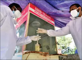  ?? ANI ?? Health workers wearing PPE kit collect swab samples for Covid-19 test, at Government Fever Hospital in Hyderabad on Thursday.