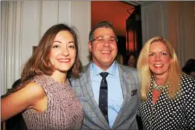  ??  ?? Teresa Murtaugh of Newtown Square (right) stops to speak with Tiffani and Evan Solomon of Philadelph­ia.