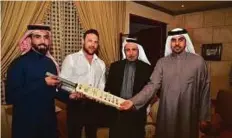  ?? Courtesy: SCC ?? Lahore Qalandars skipper Brendon McCullum with Abdul Rahman Bukhatir and his sons Khalaf and Waleed at a function at Bukhatir’s residence.