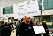  ?? AP PHOTO BY JONATHAN J. COOPER ?? Graduate student Steven Lynn holds up a sign during a protest against U.S. Attorney General Jeff Sessions, who was speaking to the California Peace Officer Associatio­n meeting, Wednesday in Sacramento.