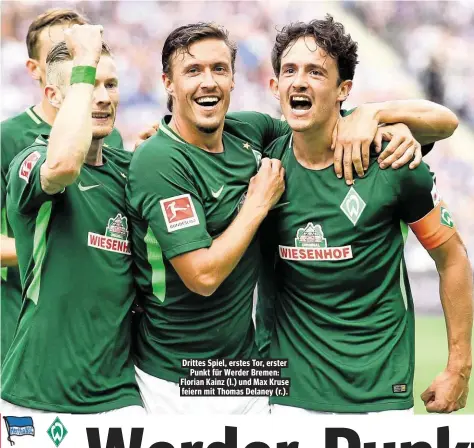  ??  ?? Drittes Spiel, erstes Tor, erster Punkt für Werder Bremen: Florian Kainz (l.) und Max Kruse feiern mit Thomas Delaney (r.).