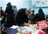  ?? Reuters ?? A doctor examines child patients at Abu Yousef Al Najjar Hospital in Rafah, southern Gaza