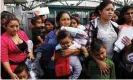  ?? Photograph: Spencer Platt/Getty Images ?? Women and children, many fleeing poverty and violence in Central America, arrive at a bus station following release from Customs and Border Protection on 22 June 2018 in McAllen, Texas.