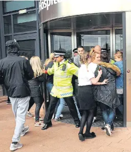  ??  ?? The self-styled ‘Alfie’s Army’ tries to storm the hospital yesterday