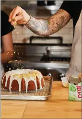  ?? PHOTOS BY COLIN CLARK — THE NEW YORK TIMES ?? Joshua Pinksy, the chef at Claud, sprinkles whipped ricotta on his Pistachio Bundt Cake, which relies on a boxed pudding mix for its familiar flavor and airy texture.