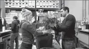  ?? AP/MANUEL BALCE CENETA ?? Ajay Kori (right) owner of UrbanStems, and Megan Sanders prepare fresh flowers for delivery last week at the company’s warehouse, in Washington.