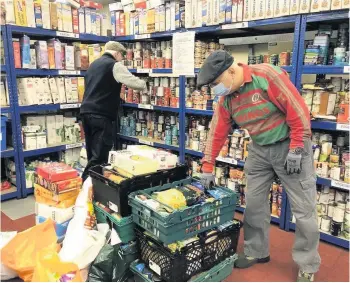  ??  ?? Busy at work
Volunteers at the East Kilbride Community Foodbank