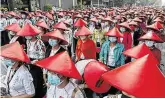  ?? PHOTO: AP ?? Anti-coup school teachers in their uniform and traditiona­l hats participat­e in a protest in Mandalay.