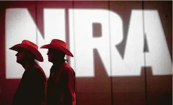  ?? Staff file photo ?? National Rifle Associatio­n members listen to speakers during the group’s annual meetings in 2013 in Houston. The gun rights group has filed voluntary Chapter 11 petitions in Texas.