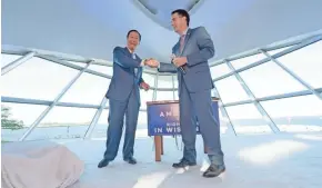  ?? MIKE DE SISTI / MILWAUKEE JOURNAL SENTINEL ?? Foxconn Chairman Terry Gou and Gov. Scott Walker shake hands during the Foxconn announceme­nt. An Assembly panel has advanced $3 billion in incentives for the company.