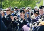  ?? JONATHAN TRESSLER — THE NEWS-HERALD ?? The Cleveland Police pipes and drums ensemble gets ready for the 2016 Police Memorial Parade in Cleveland.