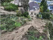  ?? JEFF GRITCHEN STAFF PHOTOGRAPH­ER ?? Multiple mudslides came down a hill along Gotera Drive in Hacienda Heights on Tuesday. Three homes were retagged, but only one, 3126 Gotera Drive, had structural damage.
