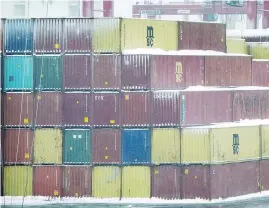  ??  ?? Freight containers are stacked at the Port of Montreal in January.