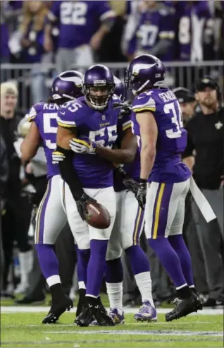  ?? CHARLIE NEIBERGALL — ASSOCIATED PRESS ?? Vikings outside linebacker Anthony Barr celebrates with teammates after making an intercepti­on against the Saints during the first half of last Sunday’s NFC divisional football playoff game at Minneapoli­s.