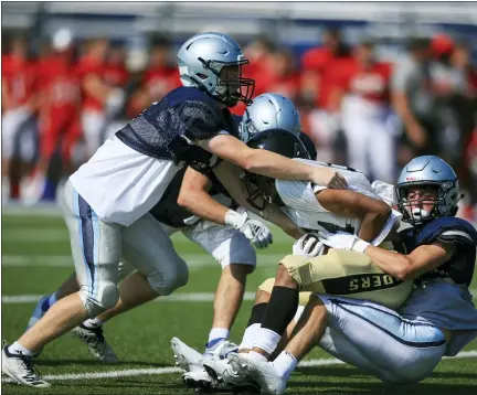  ?? TIM PHILLIS — FOR THE NEWS-HERALD ?? Photos from the Mentor, Kenston and Warren Harding scrimmage on Aug. 6at Kenston High School.