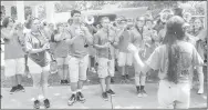  ?? Westside Eagle Observer/SUSAN HOLLAND ?? Members of the Gravette High School marching band entertain Gravette Day visitors at Kindley Park just before the opening ceremony Saturday afternoon. The band had marched in the Gravette Day parade shortly before its performanc­e at the park.