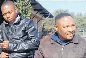  ??  ?? BROTHERS: A picture of Mlimi Elrico Phike and his older brother, Charles, outside the Northern Cape High Court that was taken recently.
Picture: Supplied