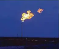  ?? Bronte Wittpenn / Bloomberg ?? Flaring, the process of burning off excess natural gas, is a controvers­ial practice that is a target of environmen­talists.