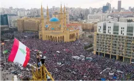  ??  ?? Protesters in front of the Muhammad al-Amin mosque in downtown Beirut, Lebanon, on Sunday. Photograph: Wael Hamzeh/EPA