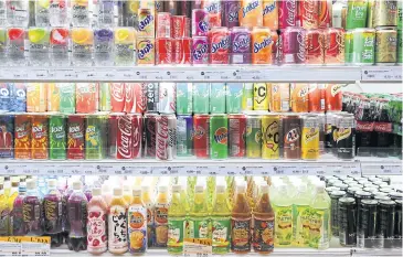  ??  ?? Soft drinks for sale at a convenienc­e store. Drinks makers are braced for intense competitio­n this summer.