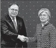  ?? LEE JIN-MAN/GETTY ?? Chief U.S. negotiator Timothy Betts greets South Korean Foreign Minister Kang Kyung-wha in Seoul on Sunday.