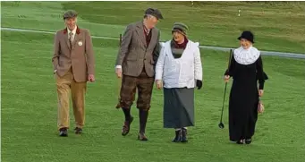  ??  ?? The Captains and Presidents walking the course on New Year’s Day for the Drive In.