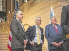  ?? | RICH HEIN/ SUN- TIMES ?? Metra Chairman Martin Oberman ( from left), Mayor Rahm Emanuel and RTA Chairman Kirk Dillard stand in front of one of Union Station’s restored staircases Friday.