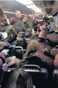  ??  ?? ●●Commuters packed onto a north west train